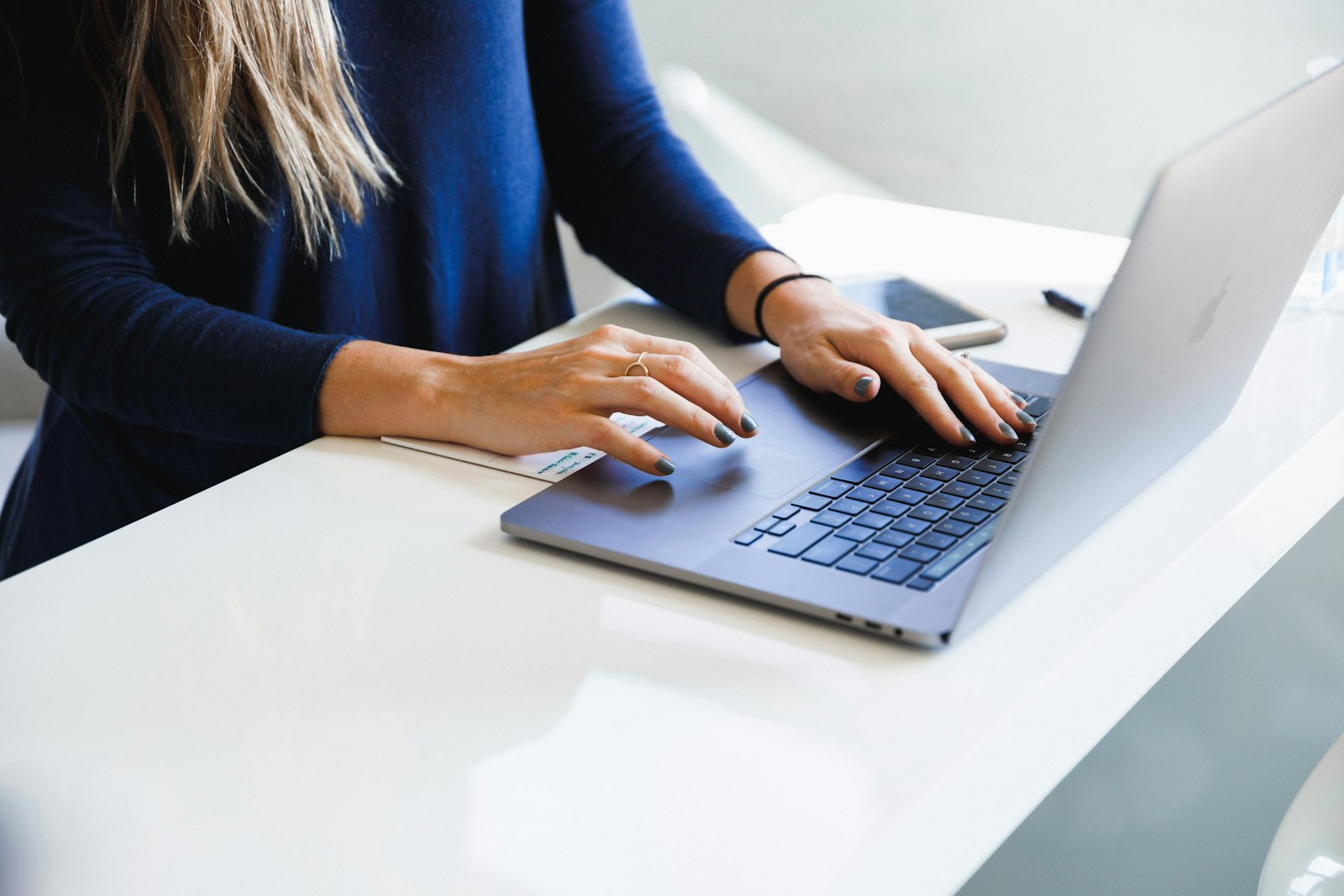 Small business owner testing the best AI agents for small business on a laptop