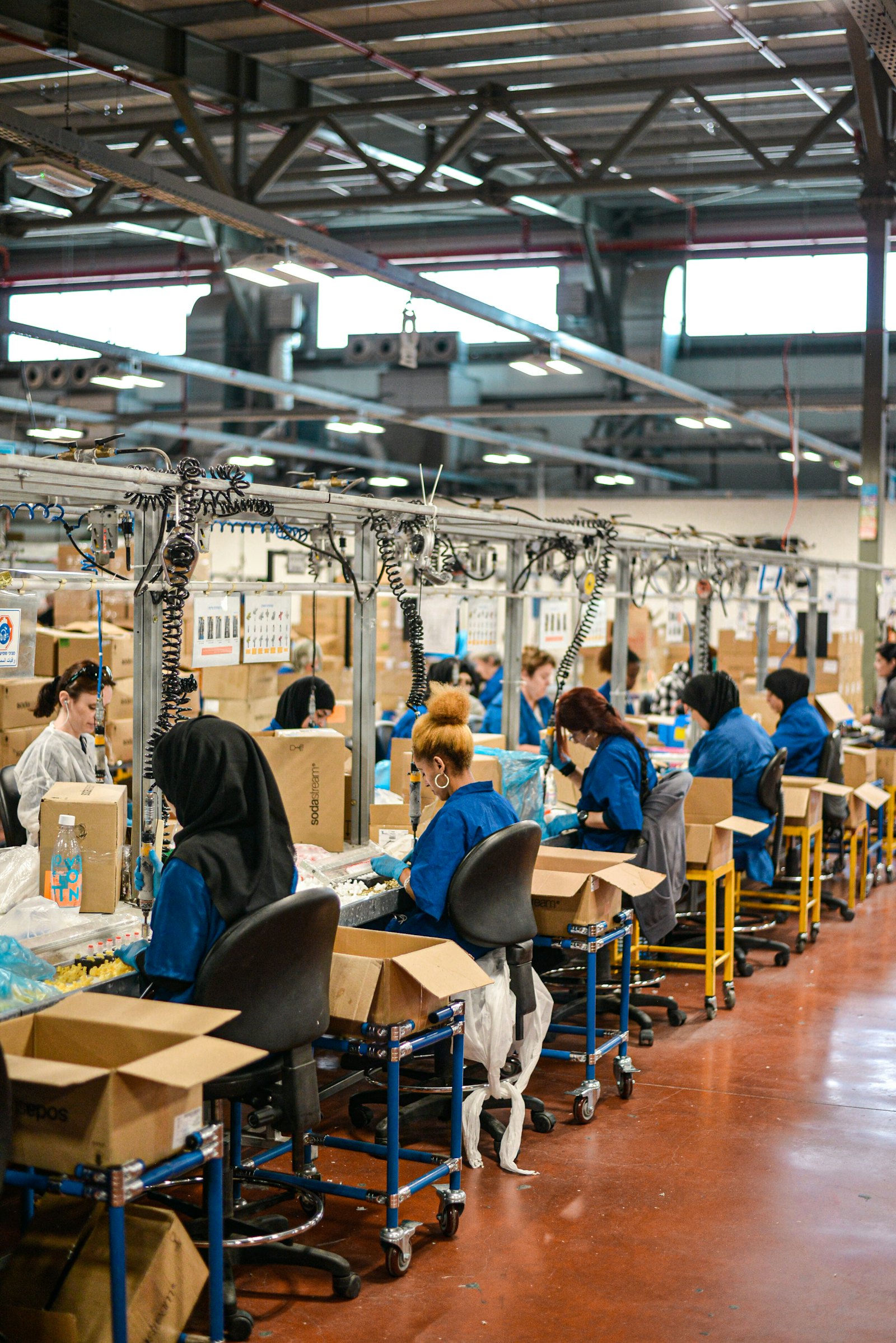 Production team on a factory floor, the kind of workplace where operational excellence examples start
